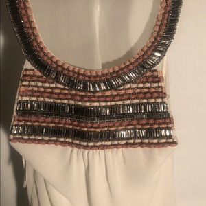 Sheer white top with ornamental/yarn neckline